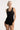 Model wearing Oscalito wool and silk lace tank top in black showing lace neckline.