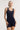 Model wearing Oscalito wool and silk lace tank top in navy showing lace neckline.