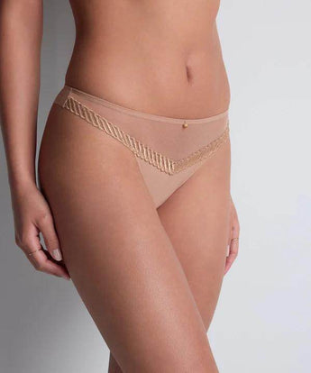 Sheer beige tanga brief with gold charm, embroidered front tulle, and soft fabric back for zero VPL and modern, sexy comfort.
