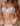White silk balcony bra with lace underwired cups, offering elegant support and comfort for both small and large busts.