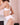 White silk suspender belt with lace front, designed to enhance curves and add elegance to your luxury lingerie look.