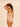 back view of the Subtile forming bodysuit in nude by Simone Pérèle showing smoothing effect and boyshort cut