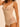 close-up of the Subtile forming body in nude by Simone Pérèle fabric showing smooth shaping material and lace texture