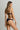 Back view of model wearing the Swarovski Crystals Thong by I.D. Sarrieri in Deep Bleumarine with minimal coverage and smooth back panel