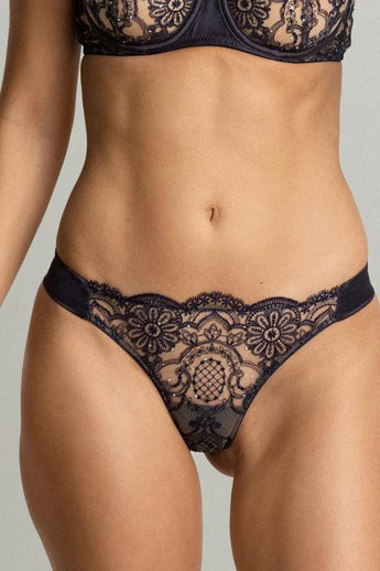 Model wearing the Swarovski Crystals Thong by I.D. Sarrieri in Deep Bleumarine with embroidered lace and crystal detailing