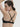 French moulded black t-shirt bra with seamless contour cups, plunge neckline, and multi-way straps in soft microfiber for invisible support.