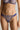 model wearing the Venetian Glass thong in blue with intricate embroidered lace