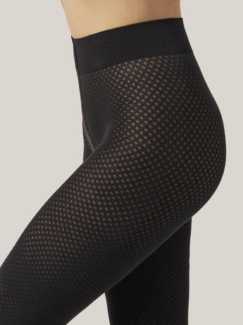 Close-up of Wolford Cotton Dot Tights in black showing detailed dot pattern and fine cotton texture