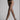 Model wearing Wolford Individual 20 Tights in black showing sheer matte finish and soft waistband