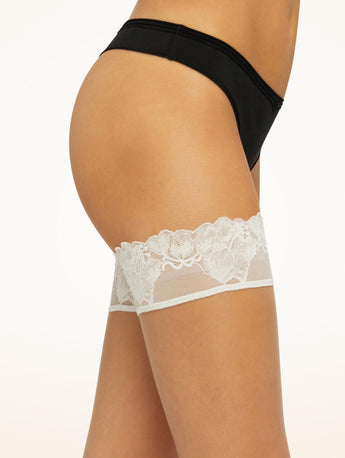 Close up of the floral lace band on Wolford Nude 8 Lace Stay Ups in Fairly Light.