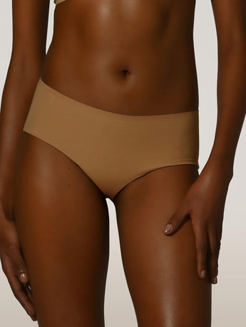Front view of the Wolford Pure Panty in Fairly Light featuring a seamless invisible brief with a smooth stretch finish.