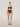 Model wearing the Wolford Sheer Touch Control Panty in black featuring medium shaping, a wide high-rise waistband, full coverage, bonded leg seams, and a smooth invisible finish.