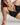 Black Gita bralette in soft organic Pima cotton with V-wire center, shaping darts, and J-hook back for a wireless, natural fit.