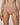 A close-up of a model wearing high-waisted, seamless underwear in a light nude beige color, shown from the waist to the upper thighs against a neutral studio background.