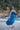 Blue long silk satin dressing gown with lace-trimmed sleeves, guipure back, and waist tie for an elegant and sensual silhouette.