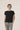 Black bamboo T-shirt with side seams and cuts, thermoregulating and eco-friendly for breathable, stylish loungewear or layering.