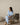 Pale blue joggers shown seated, showing banded cuff fit at the ankle