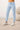 Close-up of pale blue joggers with drawstring waistband, button placket, and banded cuffs
