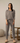 Model wearing full Aspen Dream Cozy Banded Joggers in taupe.