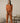 Burnt orange long sleeve top with round neckline and cuffed sleevesBurnt orange long sleeve top with round neckline and cuffed sleeves