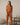 Burnt orange long sleeve top with round neckline and cuffed sleevesBurnt orange long sleeve top with round neckline and cuffed sleeves