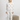 Ivory long-sleeve pajama top and matching joggers with floral skull print, crew neckline, and cuffed sleeves and ankles