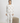 Ivory long-sleeve pajama top and matching joggers with floral skull print, crew neckline, and cuffed sleeves and ankles