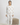 Ivory long-sleeve pajama top and matching joggers with floral skull print, crew neckline, and cuffed sleeves and ankles