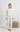 Ivory long-sleeve pajama top and matching joggers with floral skull print, crew neckline, and cuffed sleeves and ankles
