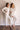Two models wearing cozy V-neck top and banded joggers in beige Cashmere