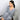 Model lounging in Heather Gray knit V-neck top