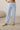 Close-up of pale blue wide leg lounge pants with elastic drawstring waistband and brushed fabric texture