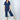 Model wearing Aspen Dream's Jolene Cropped Pajama Set in Navy with short sleeve top and cropped pants