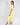 Side view of buttery yellow pajama top and cropped wide-leg pants