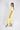 Side view of buttery yellow pajama top and cropped wide-leg pants