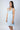 Baby Blue bamboo chemise with lace racerback and sheer lace underbust, offering breathable comfort and chic, body-hugging elegance.