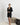 Aspen Dream black short robe with lace panels, pockets, and a sewn-in belt in soft, breathable bamboo fabric.