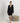 Aspen Dream black short robe with lace panels, pockets, and a sewn-in belt in soft, breathable bamboo fabric.