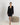 Aspen Dream black short robe with lace panels, pockets, and a sewn-in belt in soft, breathable bamboo fabric.