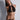 Black sheer bralette with plunging front cutout and gold ring hardware, front view