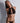 Black sheer bralette with plunging front cutout and gold ring hardware, front view