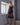 Model wearing the Bella silk satin nightdress in black with lace detailing and flattering side slits