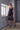 Model wearing the Bella silk satin nightdress in black with lace detailing and flattering side slits