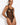 Model wearing the Bordelle Zenna Halter-Neck Body in black featuring sheer Italian mesh, a halter neckline, satin elastic straps, and 24k gold hardware.