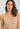 Classic seamless beige sports bra in soft ribbed fabric with light support and smooth fit, perfect for everyday comfort.