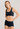 Classic seamless navy sports bra in soft ribbed fabric with light support and smooth fit, perfect for everyday comfort.