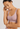 Classic seamless pink sports bra in soft ribbed fabric with light support and smooth fit, perfect for everyday comfort.