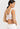 Classic seamless white sports bra in soft ribbed fabric with light support and smooth fit, perfect for everyday comfort.