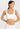 Classic seamless white sports bra in soft ribbed fabric with light support and smooth fit, perfect for everyday comfort.