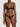 Woman wearing the Coco de Mer Arletta quarter cup bra with matching embroidered thong in emerald green.